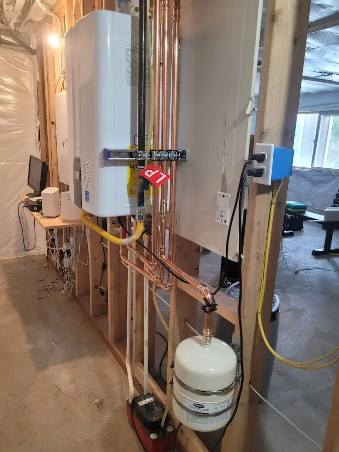 Licensed plumber repairing a kitchen sink in Reading